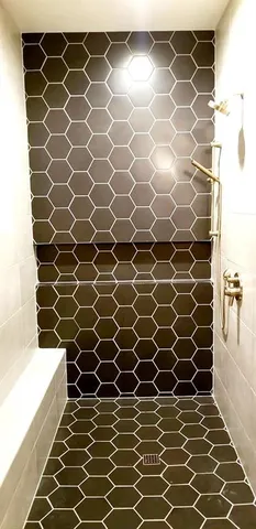 a bathroom with a sink and a shower