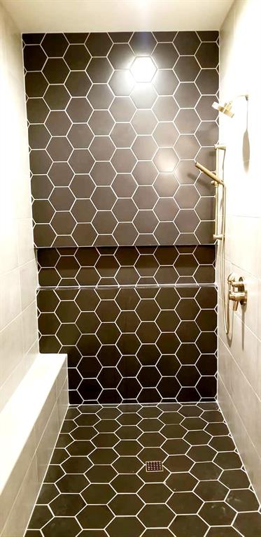 621 Stanton Road Johnson City, TX 78636 - Photo 20 of 40 a bathroom with a sink and a shower