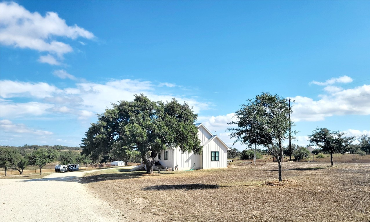 621 Stanton Road Johnson City, TX 78636 - Photo 2 of 40 a view of road and trees