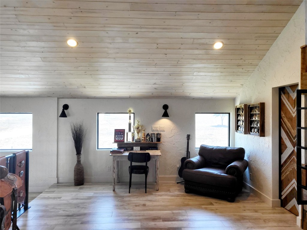 621 Stanton Road Johnson City, TX 78636 - Photo 23 of 40 a living room with furniture and a wooden floor
