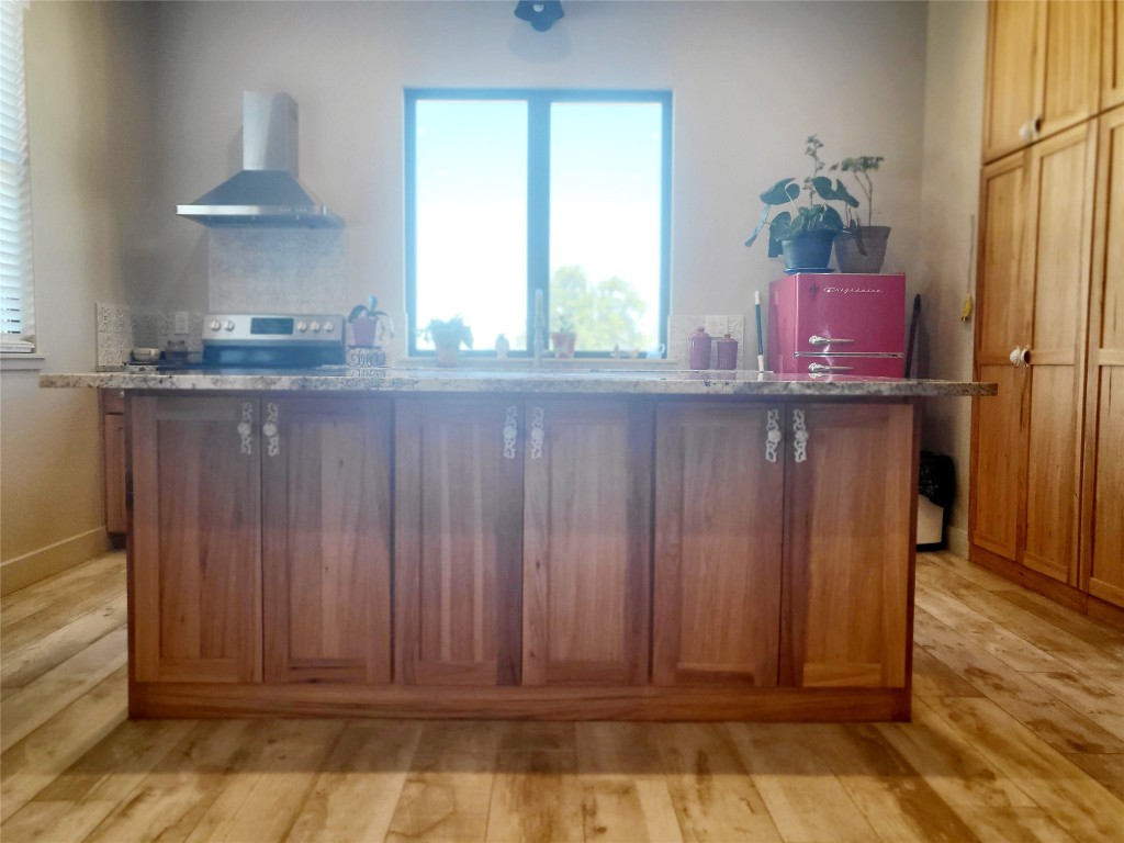 621 Stanton Road Johnson City, TX 78636 - Photo 31 of 40 a view of room with window wooden floor and cabinet