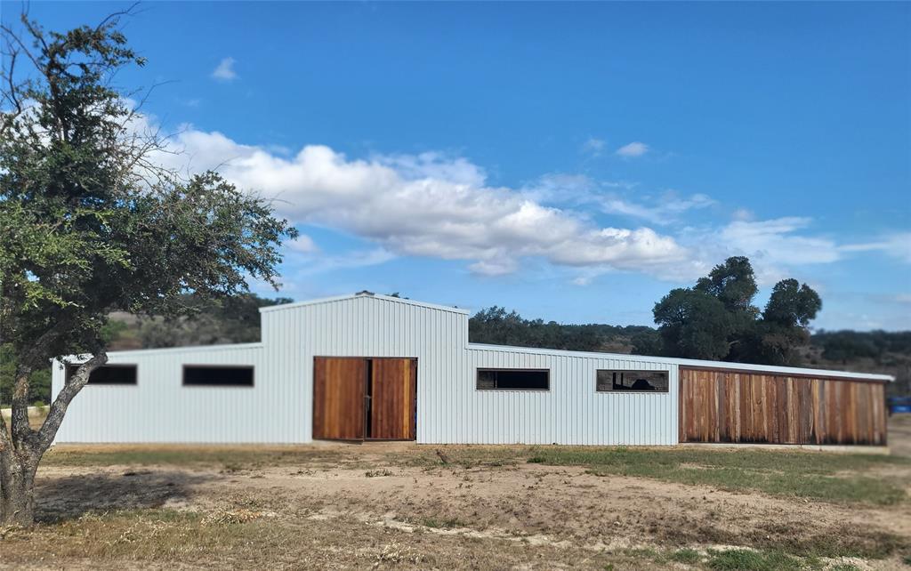 621 Stanton Road Johnson City, TX 78636 - Photo 35 of 40 a front view of a house with a yard