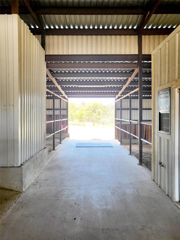 621 Stanton Road Johnson City, TX 78636 - Photo 36 of 40 a view of empty room with wooden floor and windows