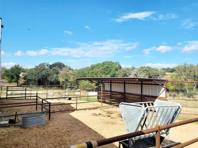 a view of a lake with a house in the background