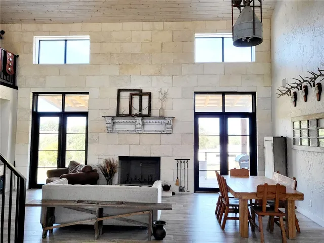 a living room with furniture wooden floor and a fireplace