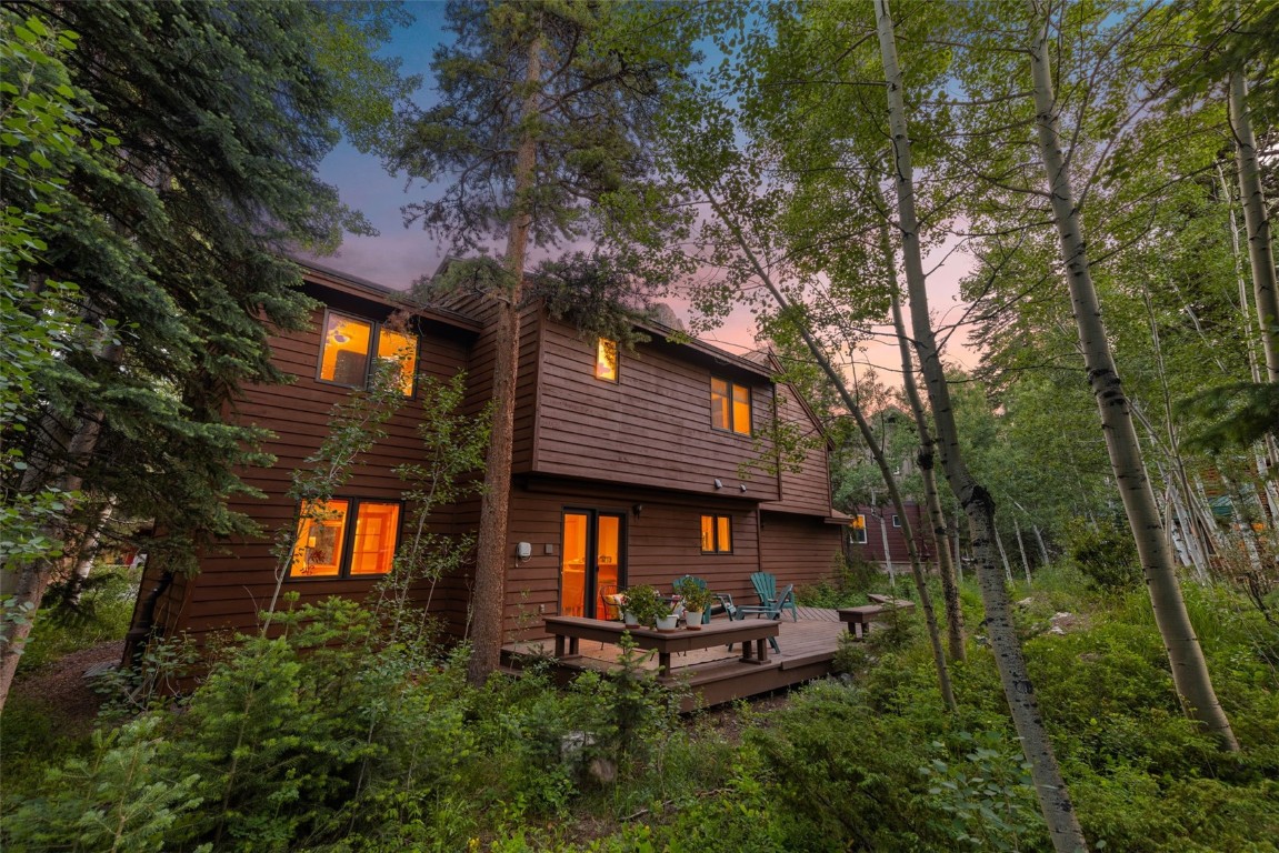91 Riverside Place Frisco, CO 80443 - Photo 2 of 43 Back of house at dusk featuring a wooden deck