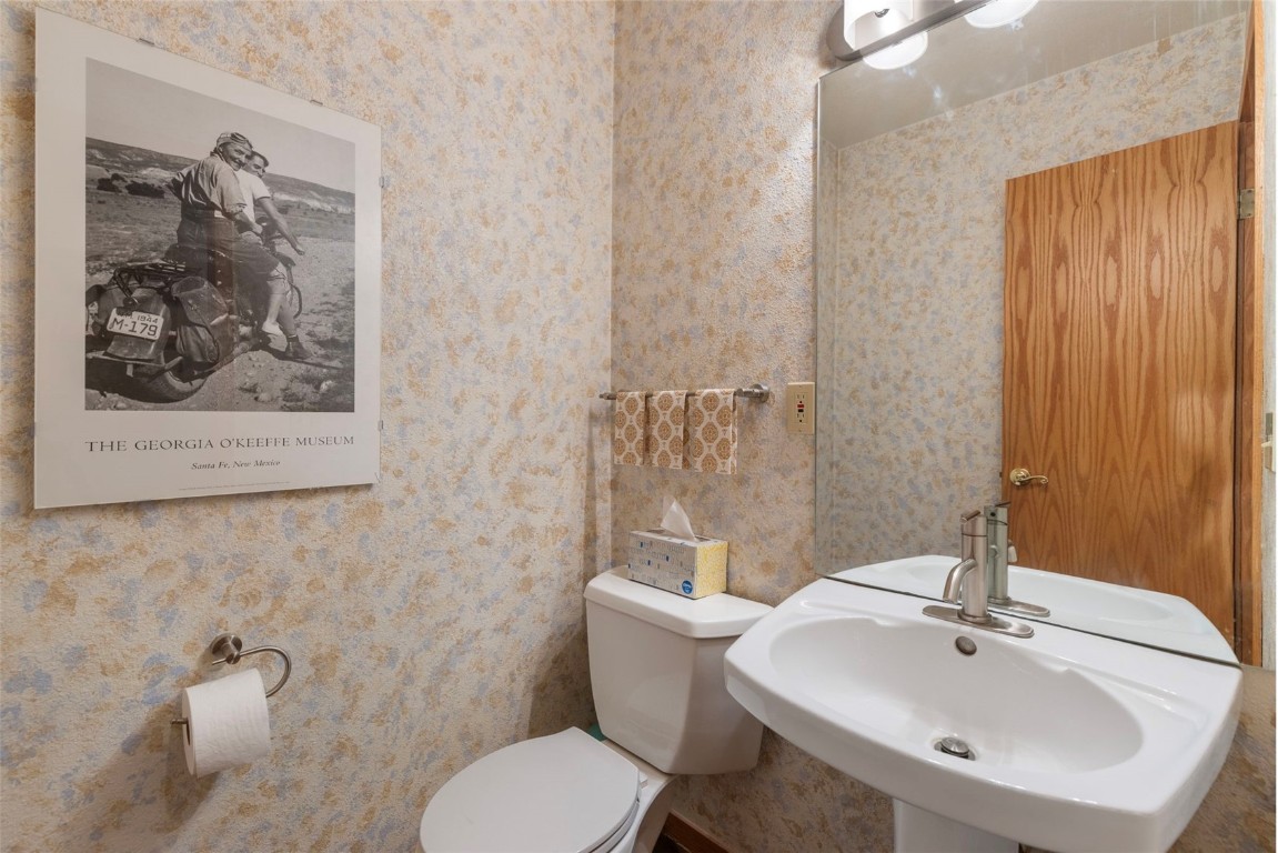 91 Riverside Place Frisco, CO 80443 - Photo 27 of 43 Half bathroom featuring toilet and wallpapered walls