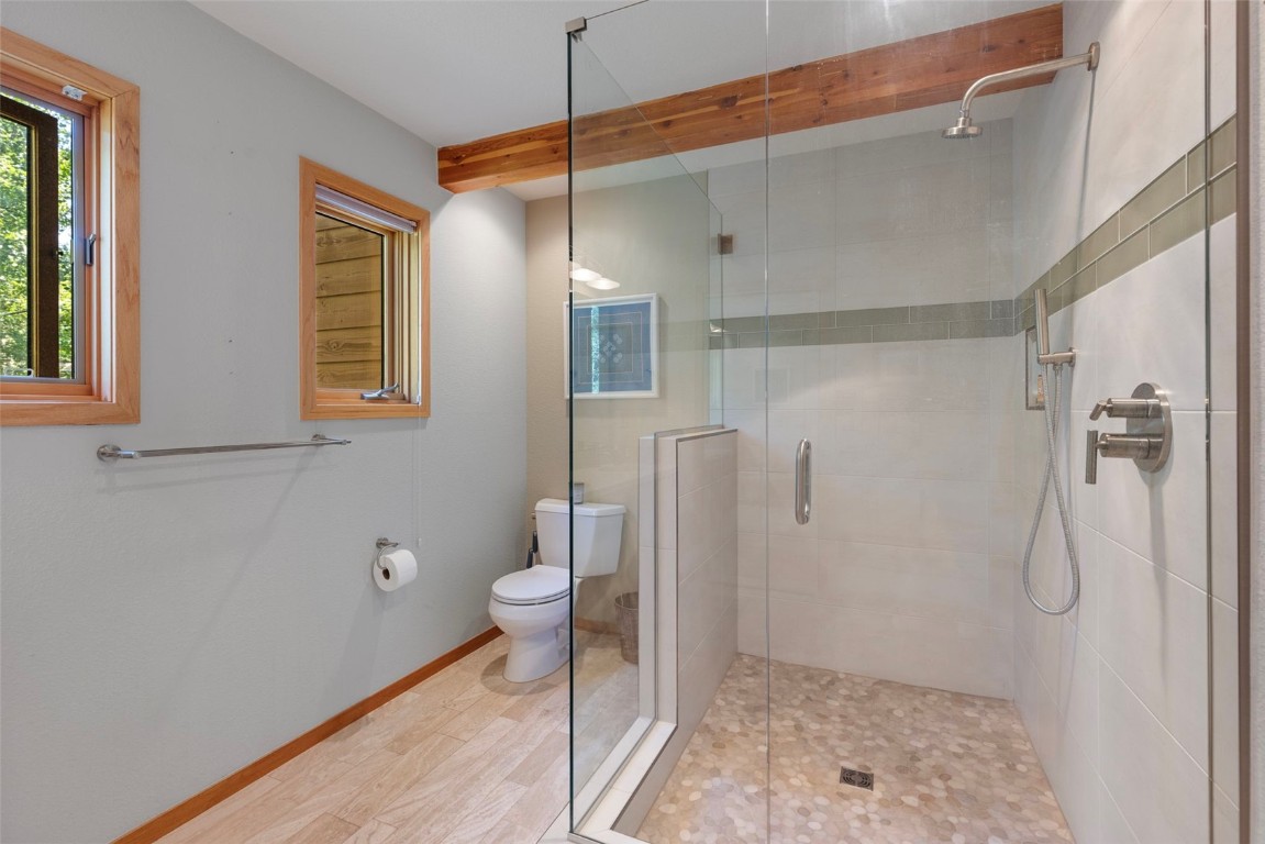 91 Riverside Place Frisco, CO 80443 - Photo 34 of 43 Bathroom featuring a stall shower and beamed ceiling
