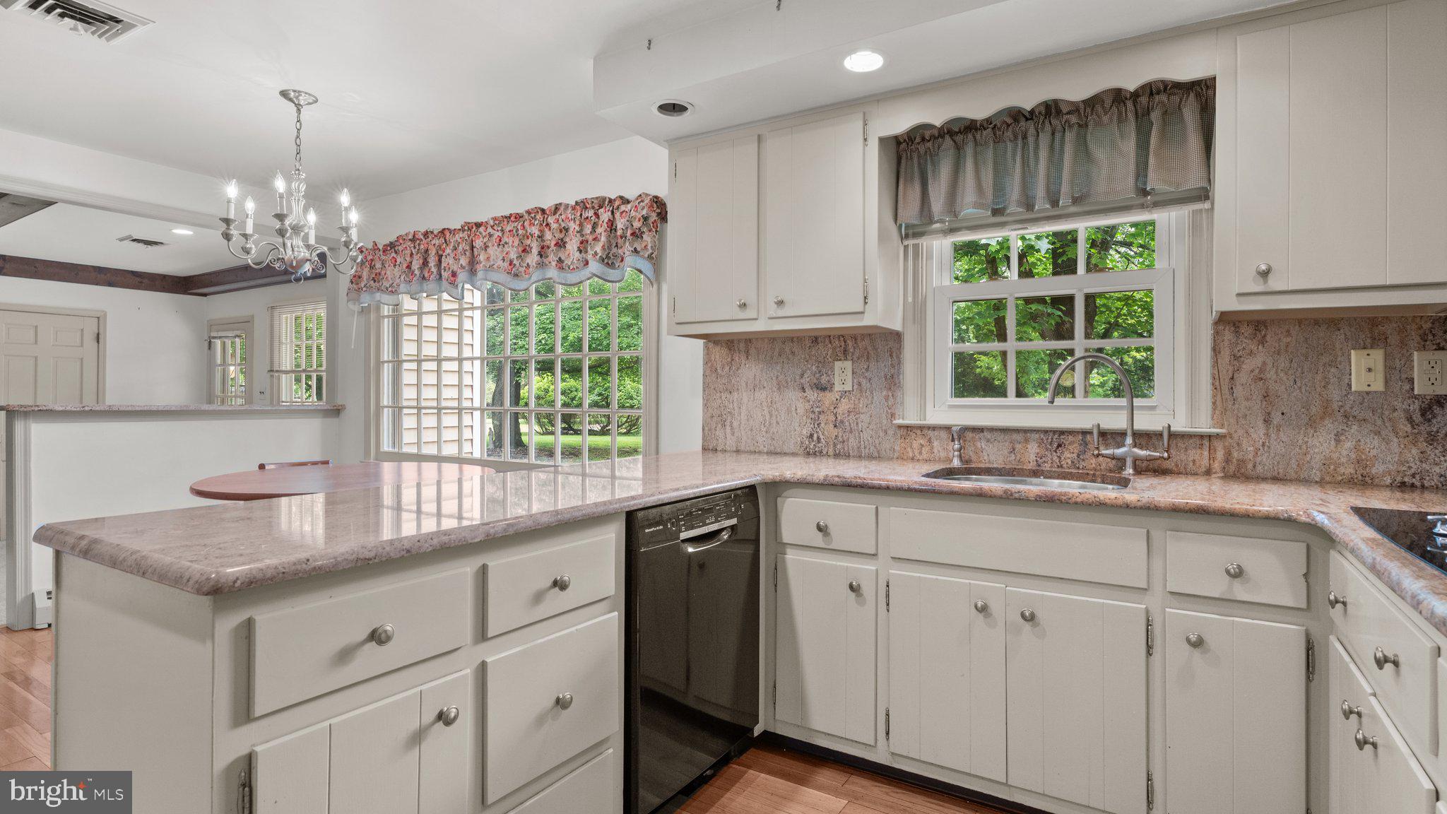 741 Spring Valley Road Doylestown, PA 18901 - Photo 13 of 41 a kitchen with a sink window and cabinets