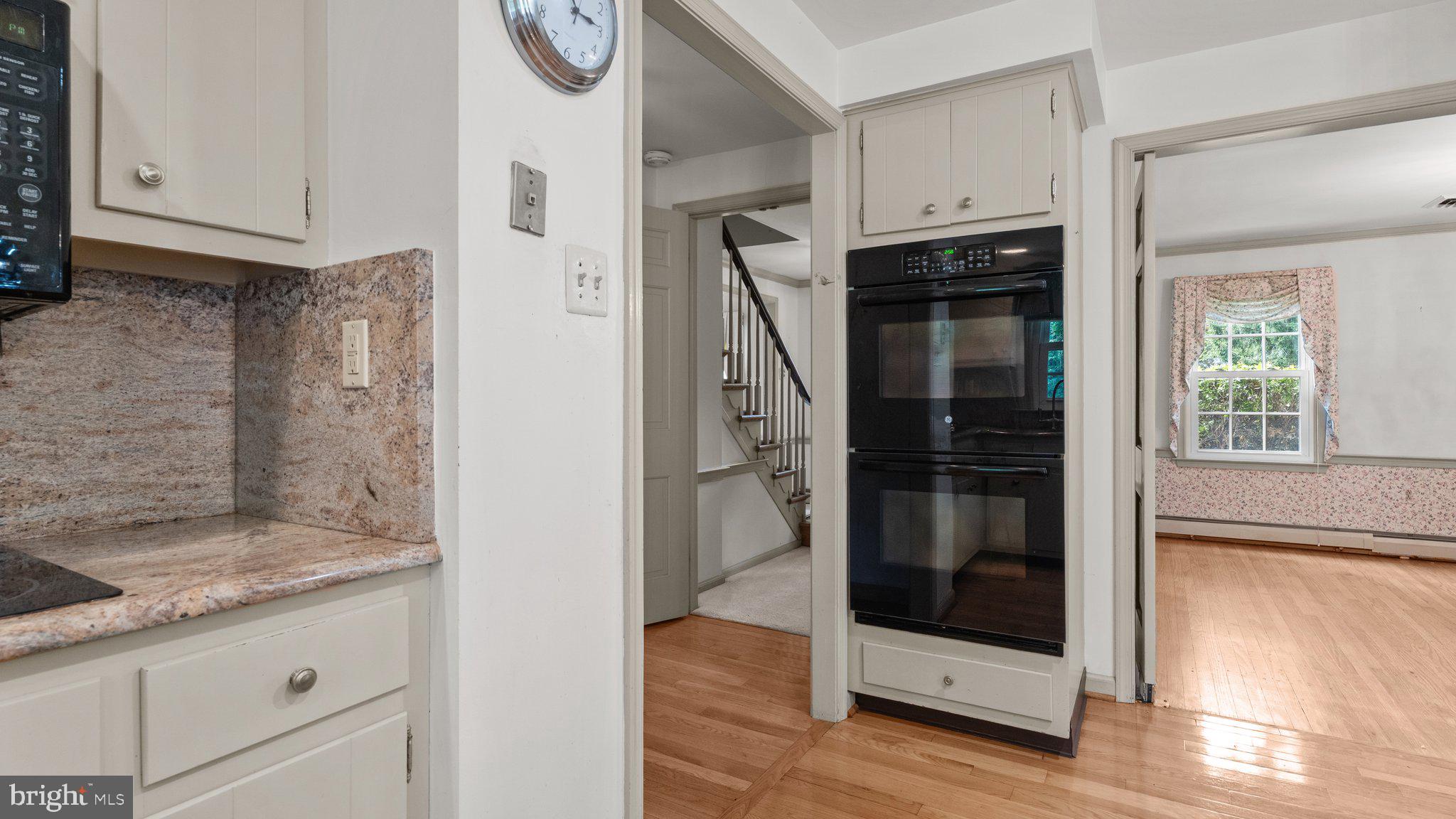 741 Spring Valley Road Doylestown, PA 18901 - Photo 15 of 41 a kitchen with granite countertop a refrigerator and a stove