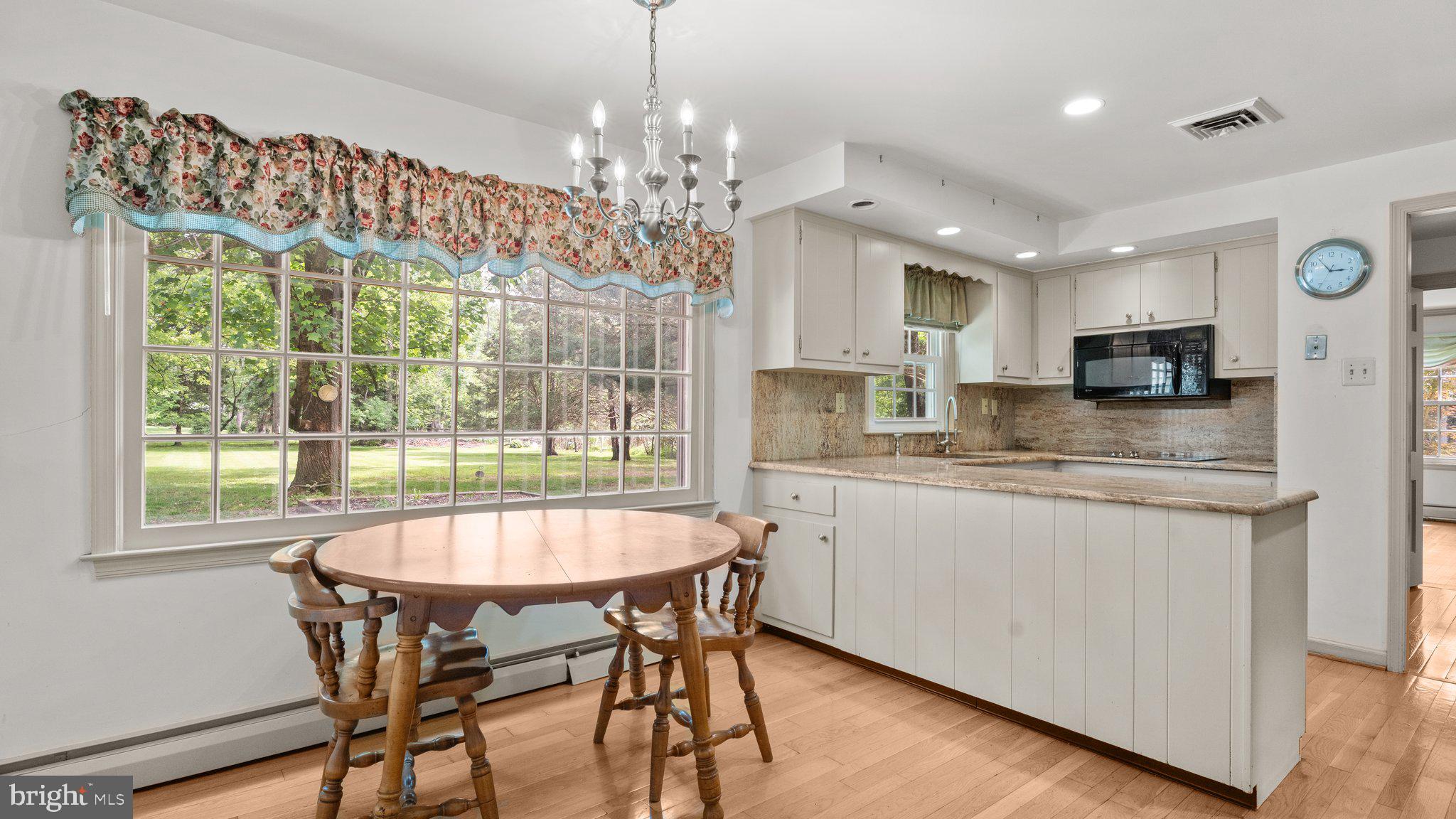 741 Spring Valley Road Doylestown, PA 18901 - Photo 17 of 41 a large kitchen with kitchen island a table and chairs in it