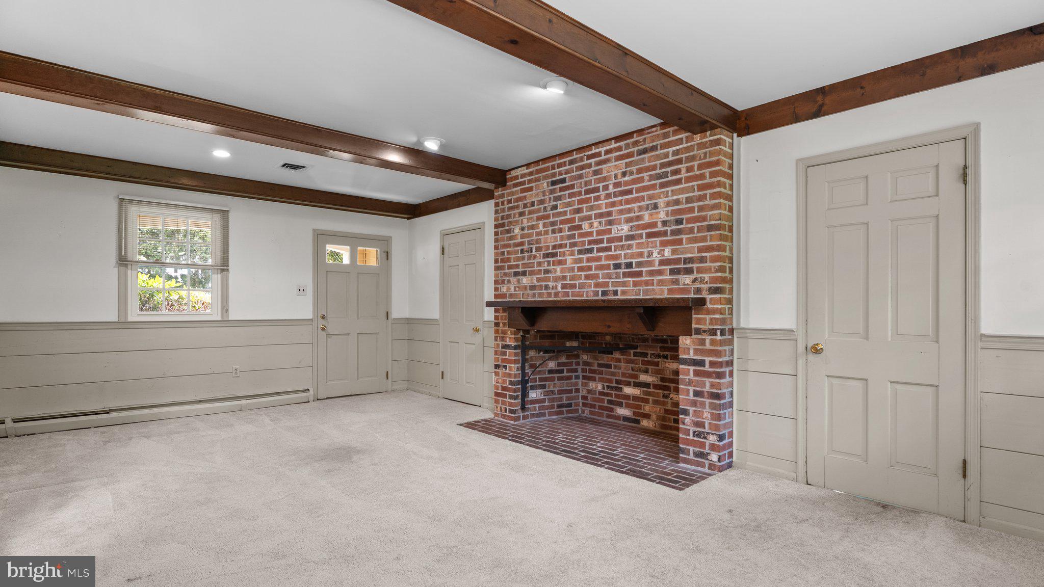 741 Spring Valley Road Doylestown, PA 18901 - Photo 18 of 41 a view of empty room with windows and fireplace