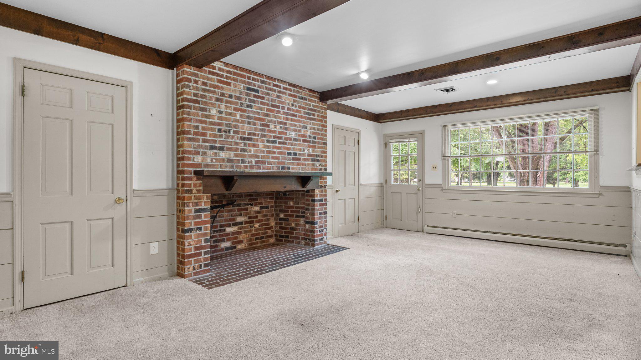 741 Spring Valley Road Doylestown, PA 18901 - Photo 19 of 41 an empty room with windows and fireplace