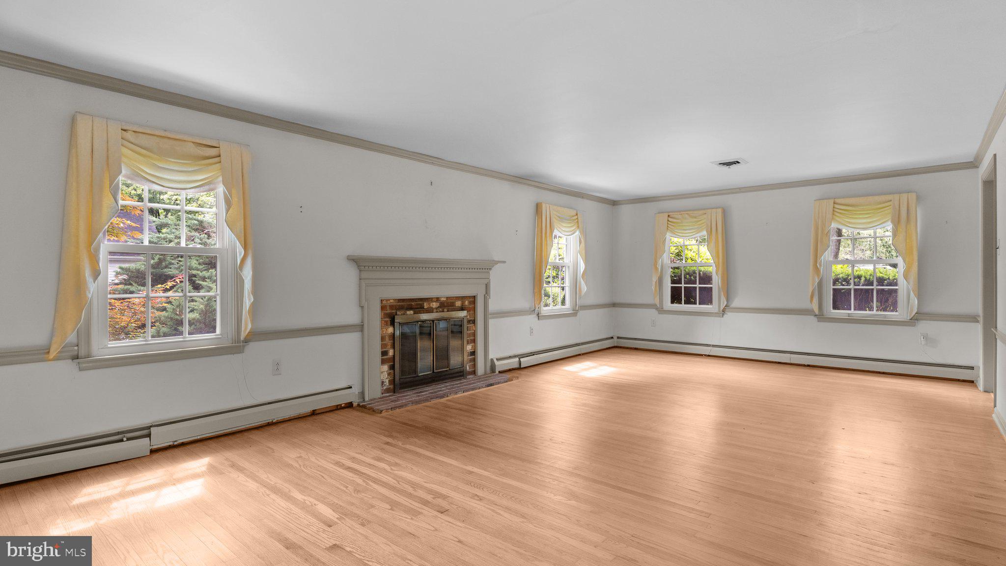 741 Spring Valley Road Doylestown, PA 18901 - Photo 23 of 41 an empty room with windows and fireplace