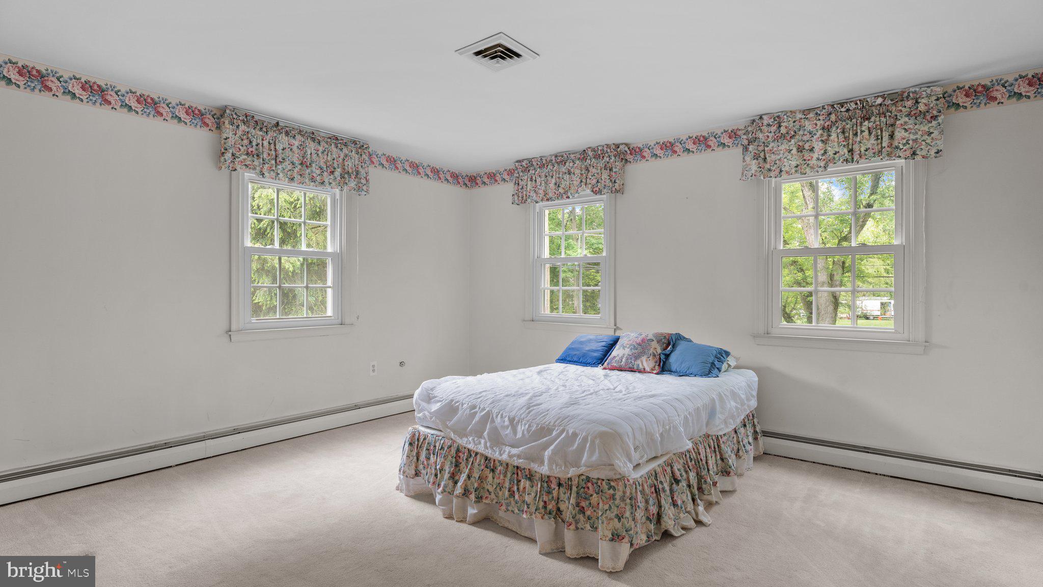741 Spring Valley Road Doylestown, PA 18901 - Photo 27 of 41 a bedroom with a bed and a window