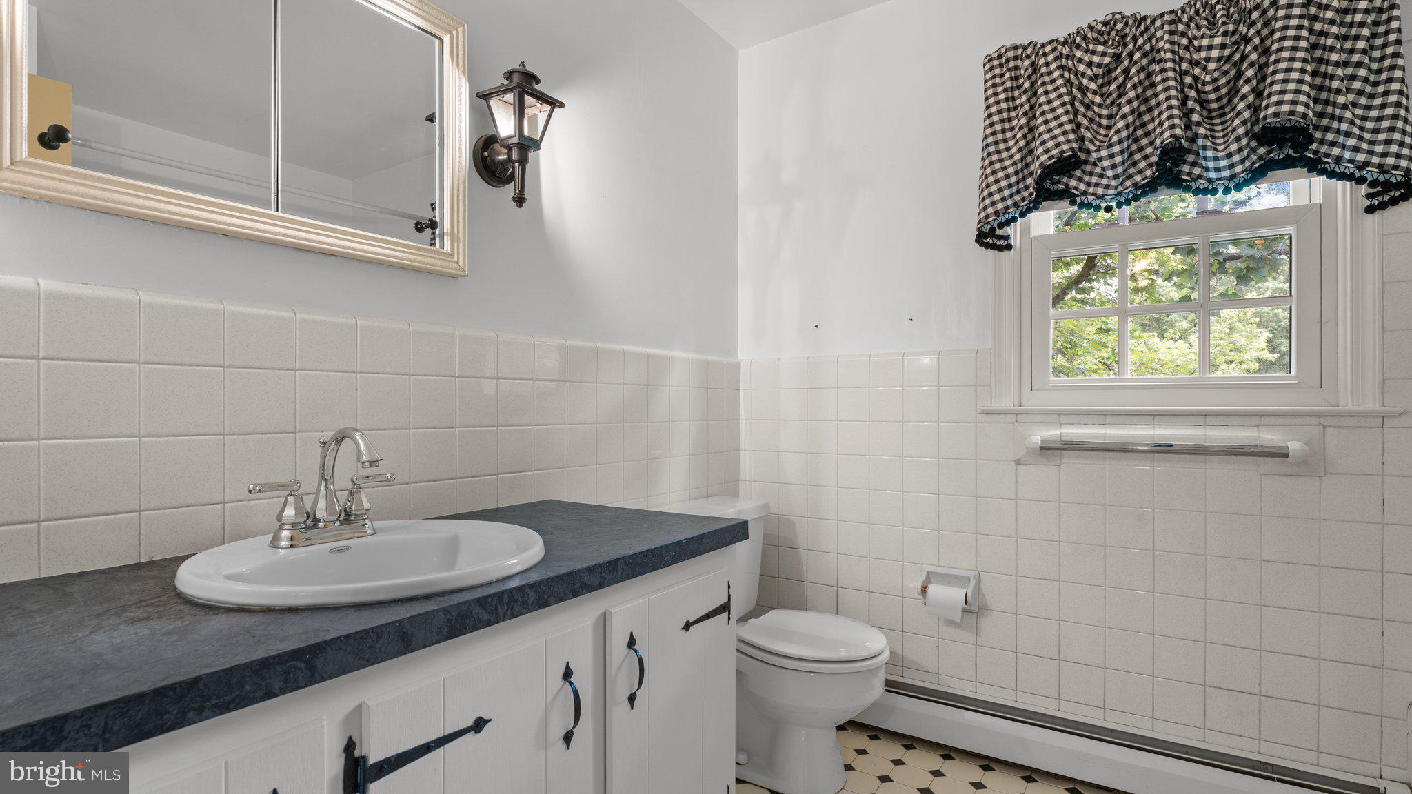 741 Spring Valley Road Doylestown, PA 18901 - Photo 34 of 41 a bathroom with a sink and a toilet