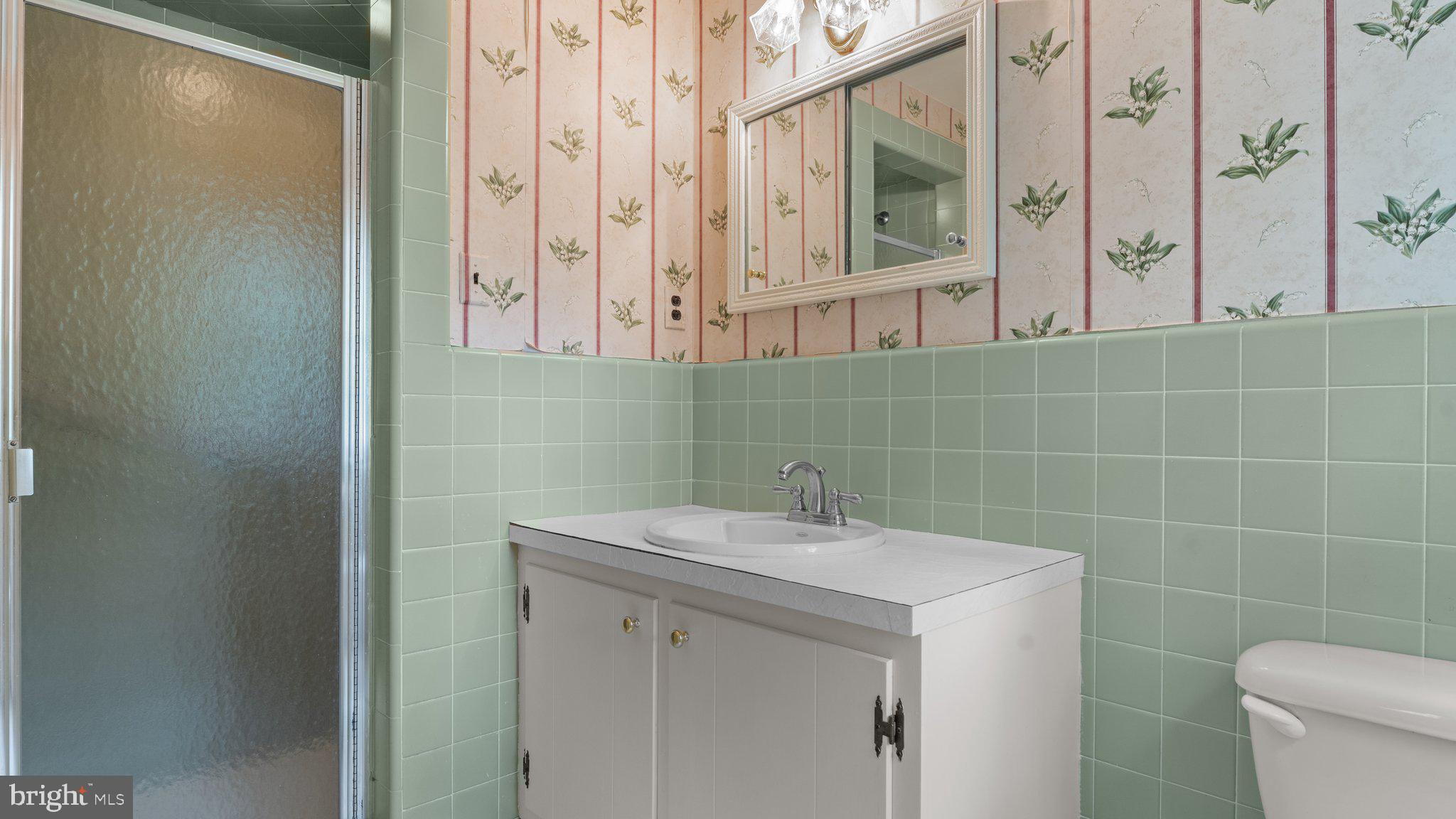 741 Spring Valley Road Doylestown, PA 18901 - Photo 35 of 41 a bathroom with a sink a toilet and a mirror