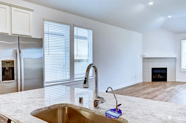 a bedroom with a bed and a sink