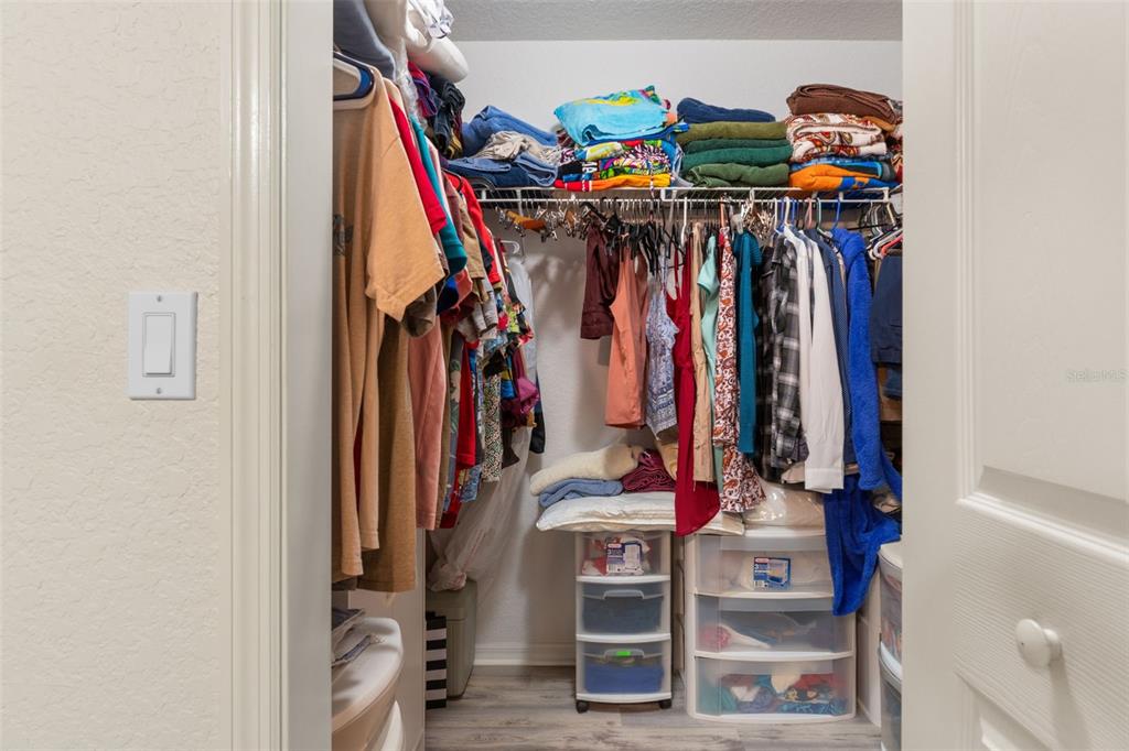 2104 Linwood Avenue Spring Hill, FL 34608 - Photo 22 of 44 a view of walk in closet with clothes