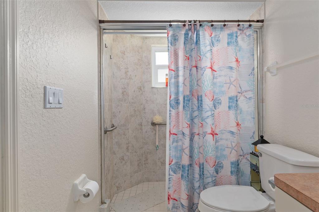 2104 Linwood Avenue Spring Hill, FL 34608 - Photo 24 of 44 a bathroom with a shower a toilet and a shower
