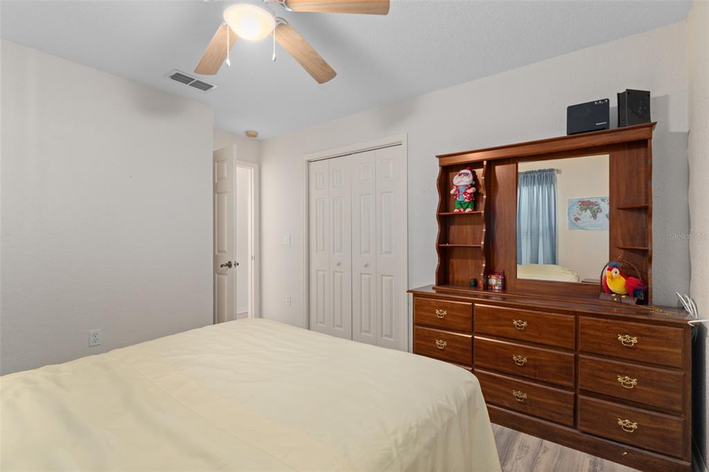 2104 Linwood Avenue Spring Hill, FL 34608 - Photo 29 of 44 a bedroom with a bed and a dresser