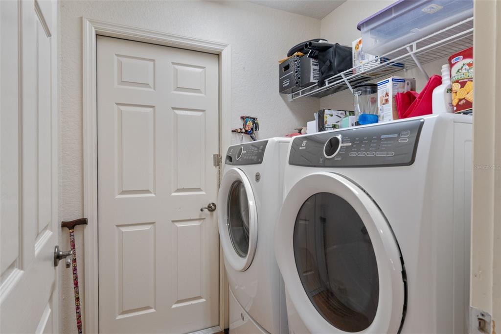 2104 Linwood Avenue Spring Hill, FL 34608 - Photo 31 of 44 a utility room with dryer and washer