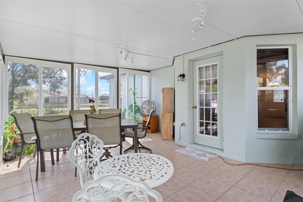 2104 Linwood Avenue Spring Hill, FL 34608 - Photo 35 of 44 a living room with furniture a window and a dining table