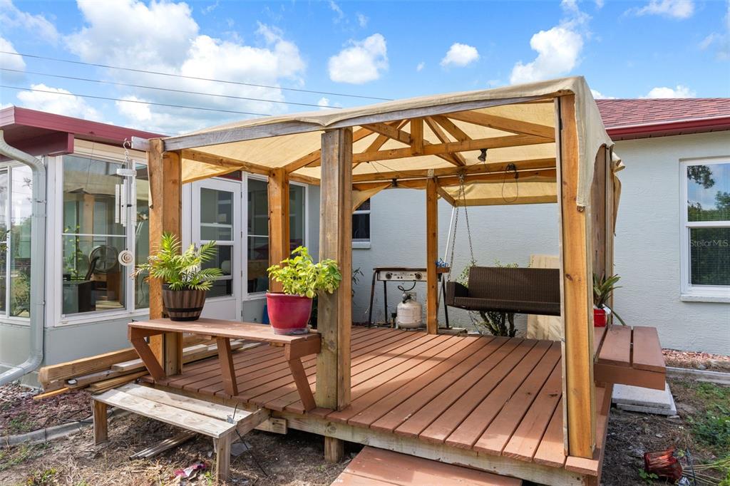 2104 Linwood Avenue Spring Hill, FL 34608 - Photo 37 of 44 a outdoor living space with furniture and a potted plant