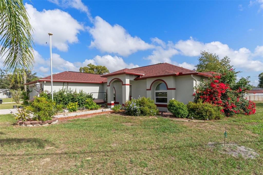 2104 Linwood Avenue Spring Hill, FL 34608 - Photo 4 of 44 a front view of a house with a yard