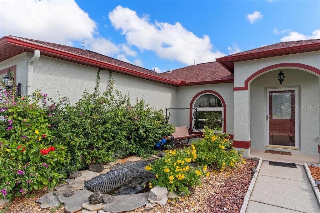 2104 Linwood Avenue Spring Hill, FL 34608 - Photo 6 of 44 a front view of a house with a yard