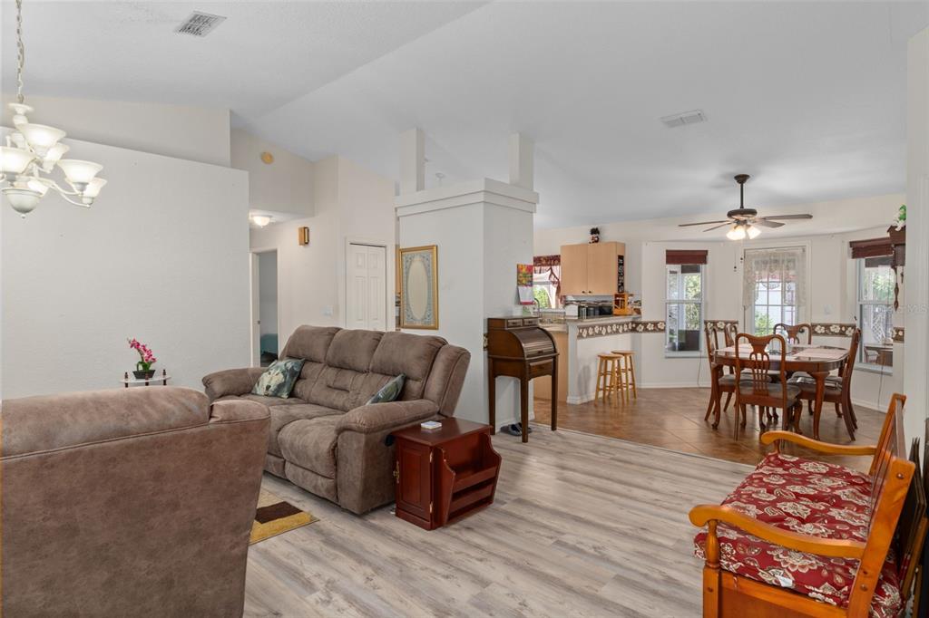 2104 Linwood Avenue Spring Hill, FL 34608 - Photo 8 of 44 a living room with furniture and wooden floor