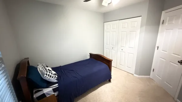 a view of a hardwood floor and wardrobe