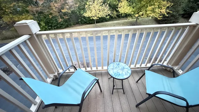 a view of a chair and table in the patio