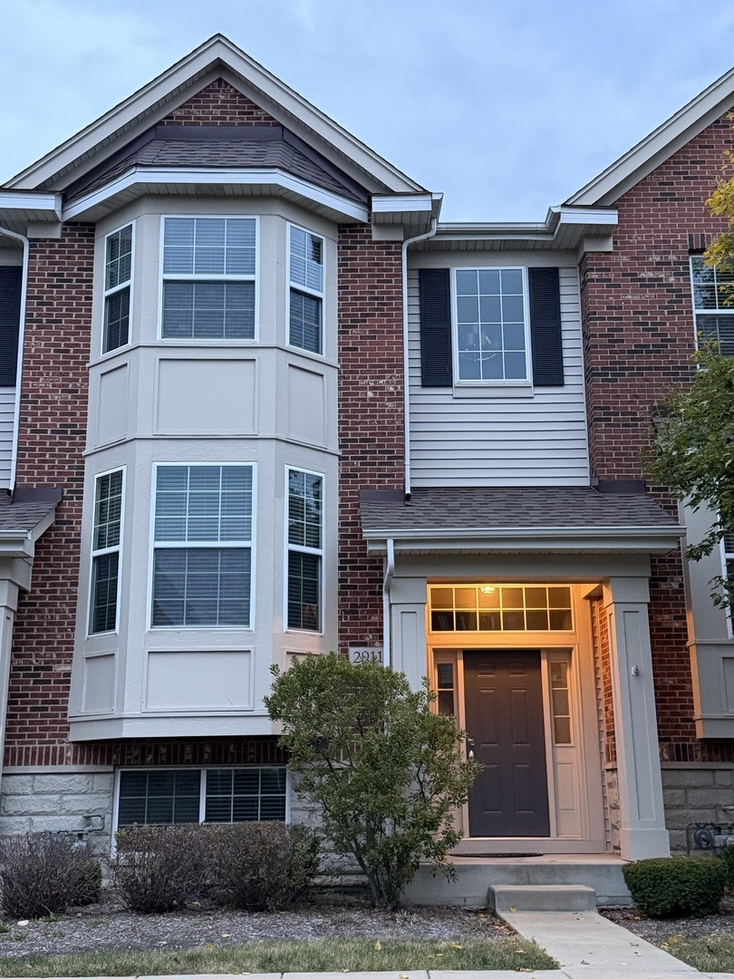 2911 Henley Lane, Unit 2911 Naperville, IL 60540 - Photo 2 of 23 a front view of a house