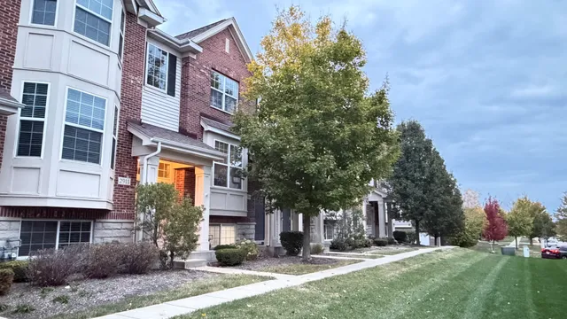 a view of a building with a yard