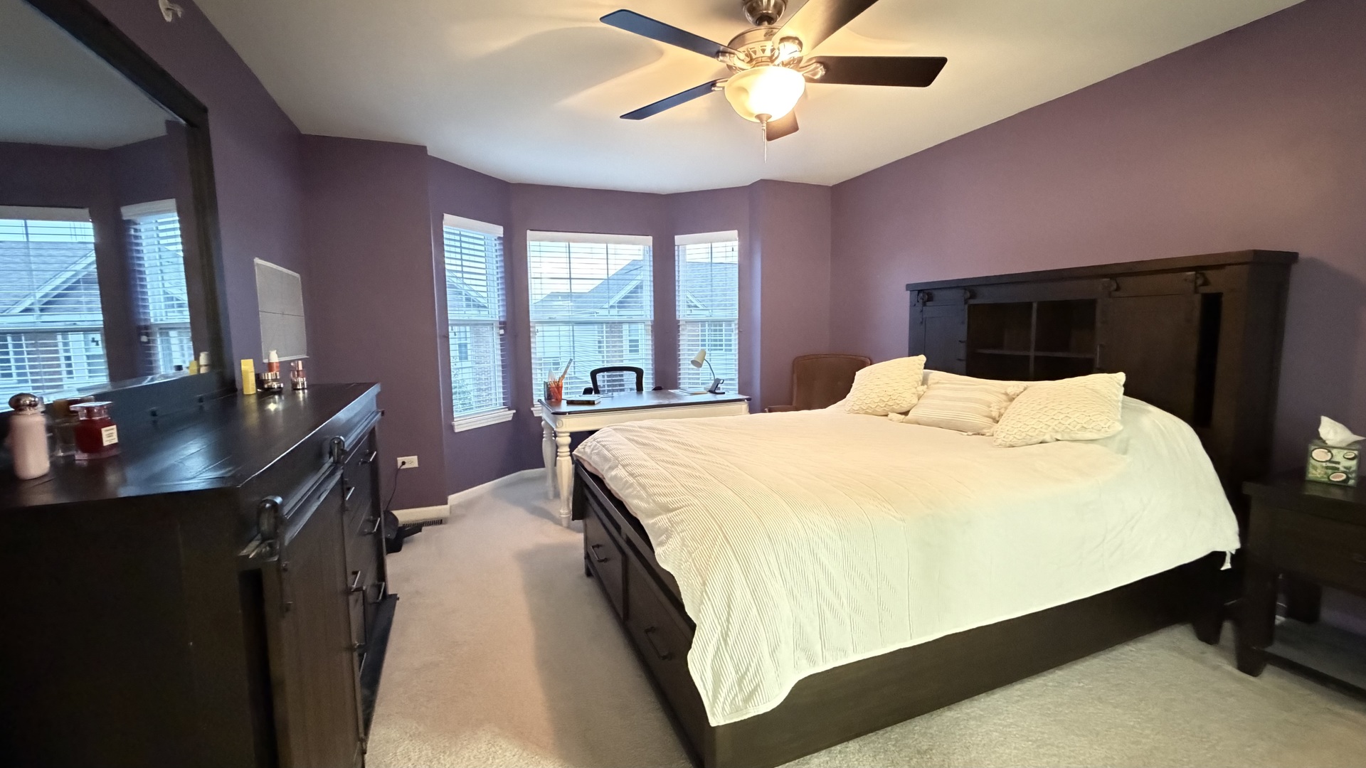 2911 Henley Lane, Unit 2911 Naperville, IL 60540 - Photo 9 of 23 a bedroom with a bed and a chandelier