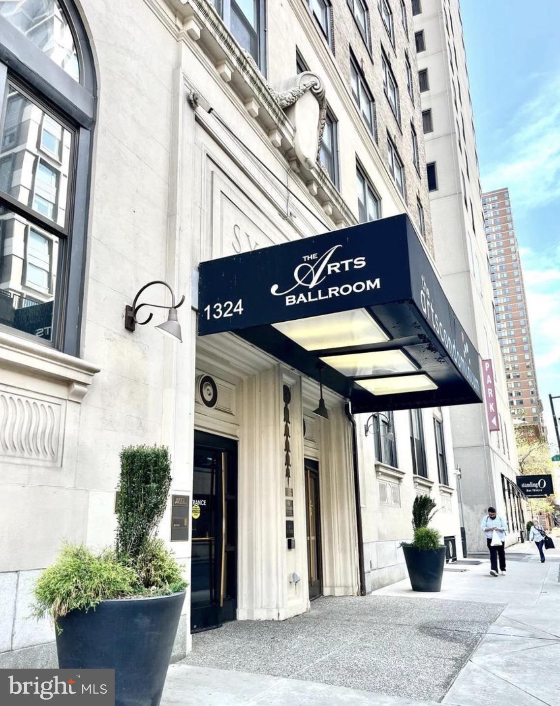 1324-00 Locust Street, Unit 1017 Philadelphia, PA 19107 - Photo 1 of 13 a front view of a building with street