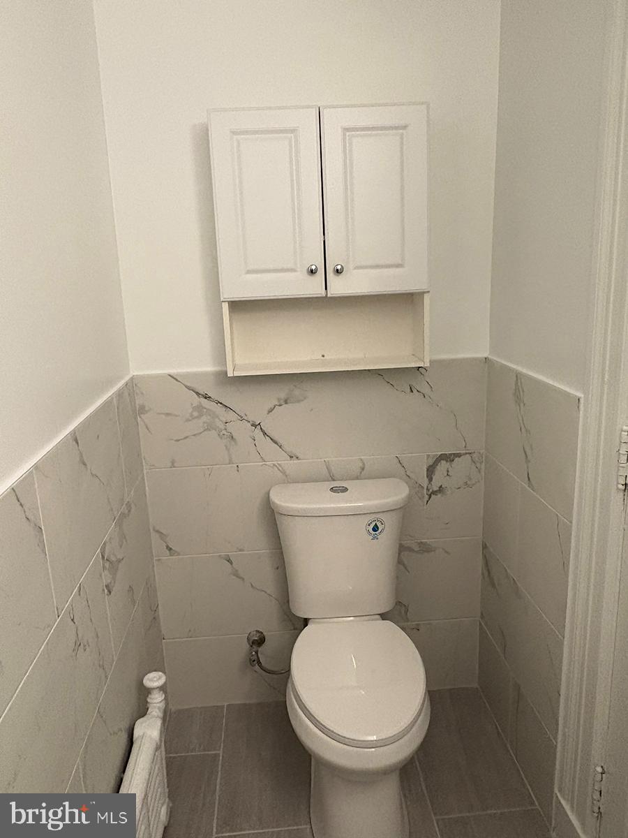 1324-00 Locust Street, Unit 1017 Philadelphia, PA 19107 - Photo 11 of 13 a bathroom with a toilet and a sink