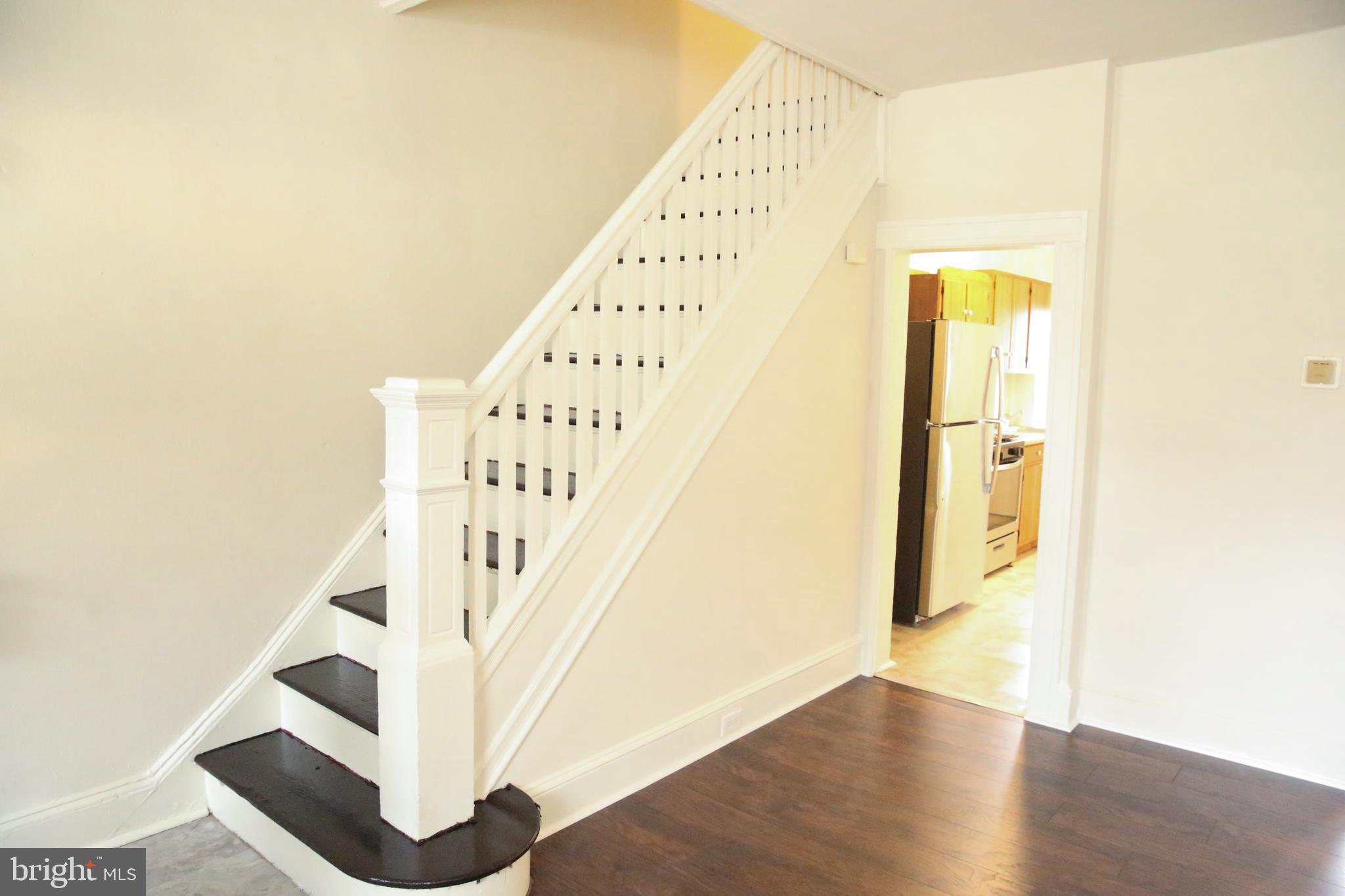 4852 Pimlico Road Baltimore, MD 21215 - Photo 2 of 40 a view of an entryway with wooden floor