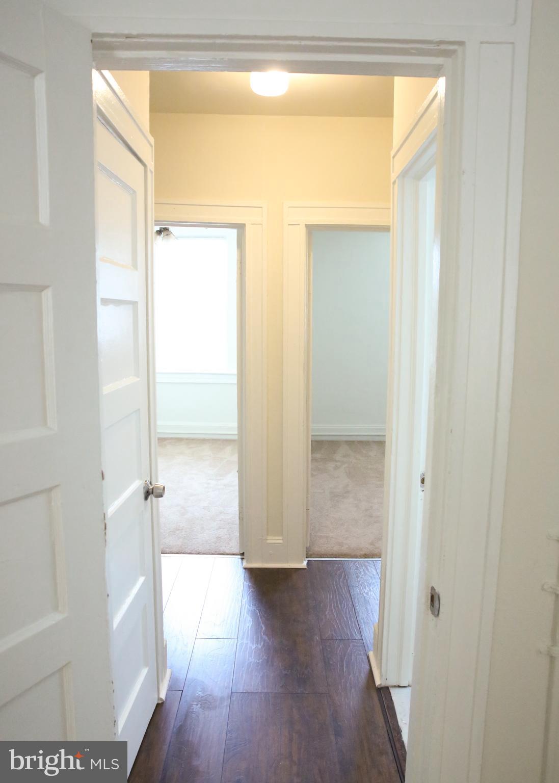 4852 Pimlico Road Baltimore, MD 21215 - Photo 16 of 40 a view of empty room with wooden floor and fan