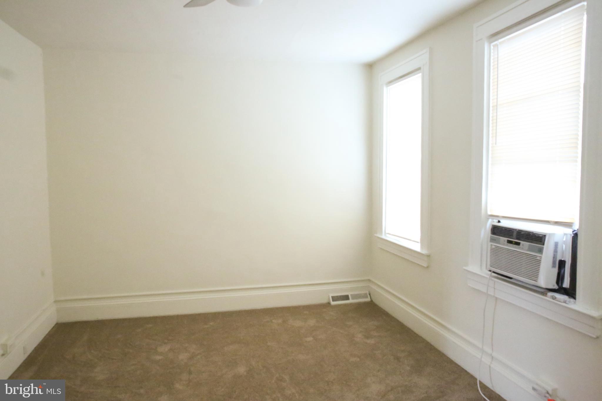 4852 Pimlico Road Baltimore, MD 21215 - Photo 18 of 40 an empty room with a fireplace
