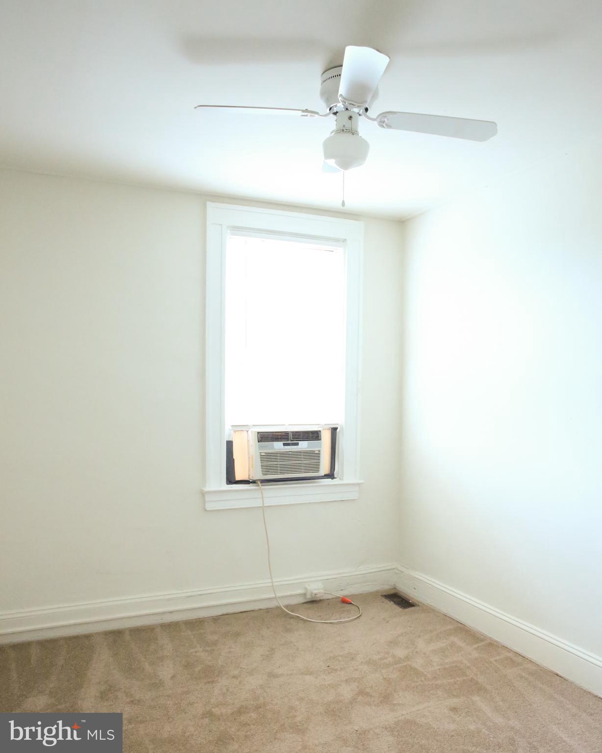 4852 Pimlico Road Baltimore, MD 21215 - Photo 19 of 40 an empty room with a window