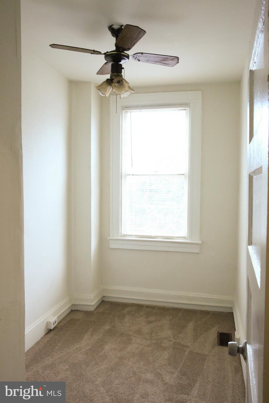 4852 Pimlico Road Baltimore, MD 21215 - Photo 20 of 40 a view of an empty room with a window