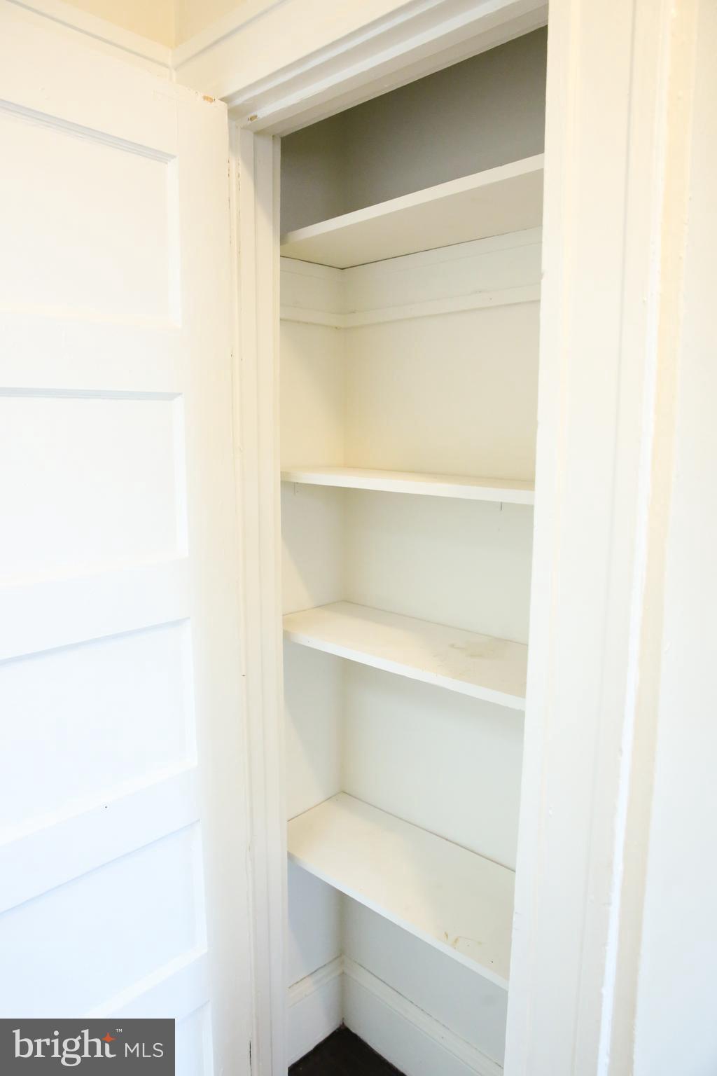 4852 Pimlico Road Baltimore, MD 21215 - Photo 28 of 40 a storage room with empty racks