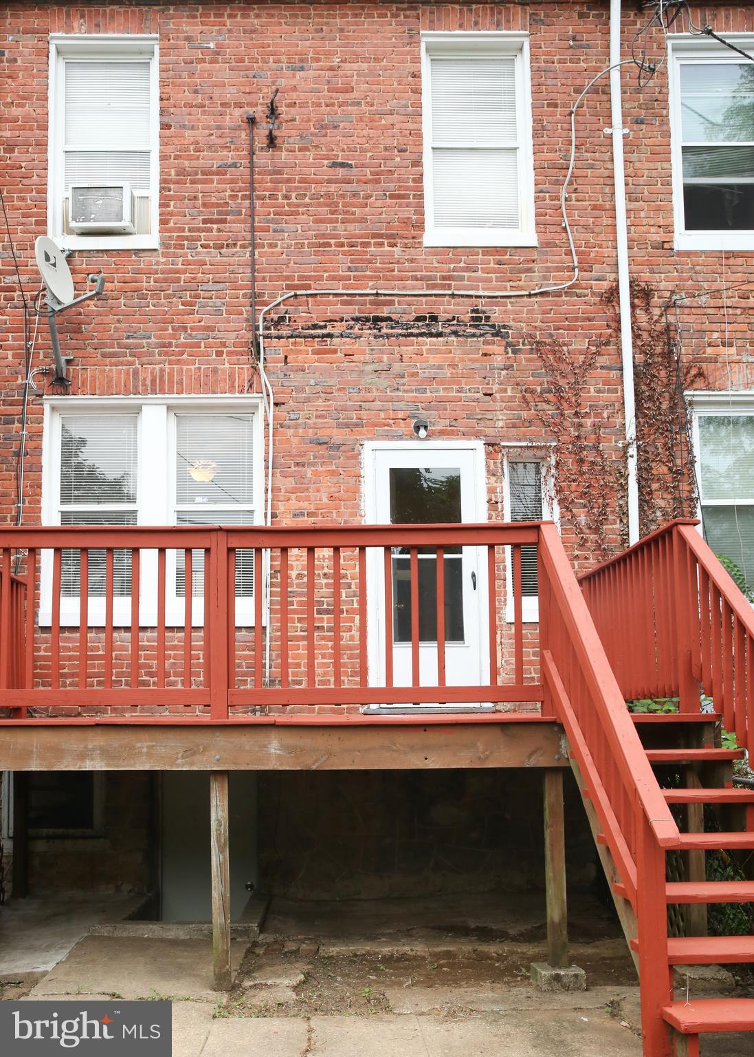 4852 Pimlico Road Baltimore, MD 21215 - Photo 32 of 40 a front view of a house with many windows