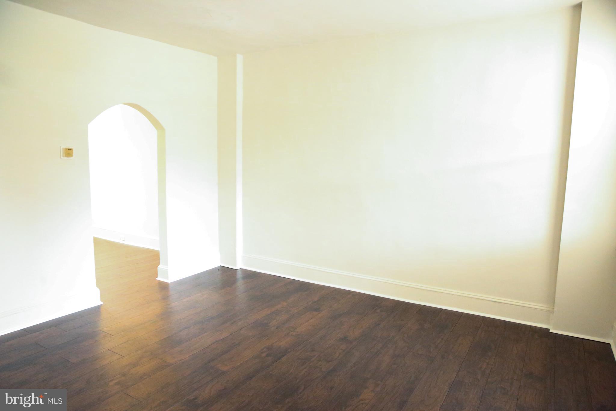 4852 Pimlico Road Baltimore, MD 21215 - Photo 5 of 40 a view of a room with wooden floor