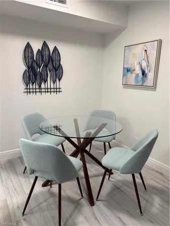 a view of a livingroom with furniture and wooden floor