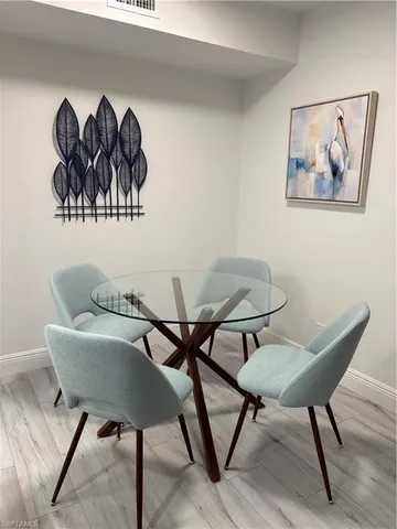 a view of a livingroom with furniture and wooden floor