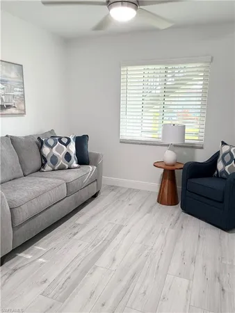 a living room with furniture and windows
