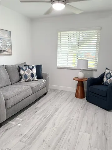 a living room with furniture and windows